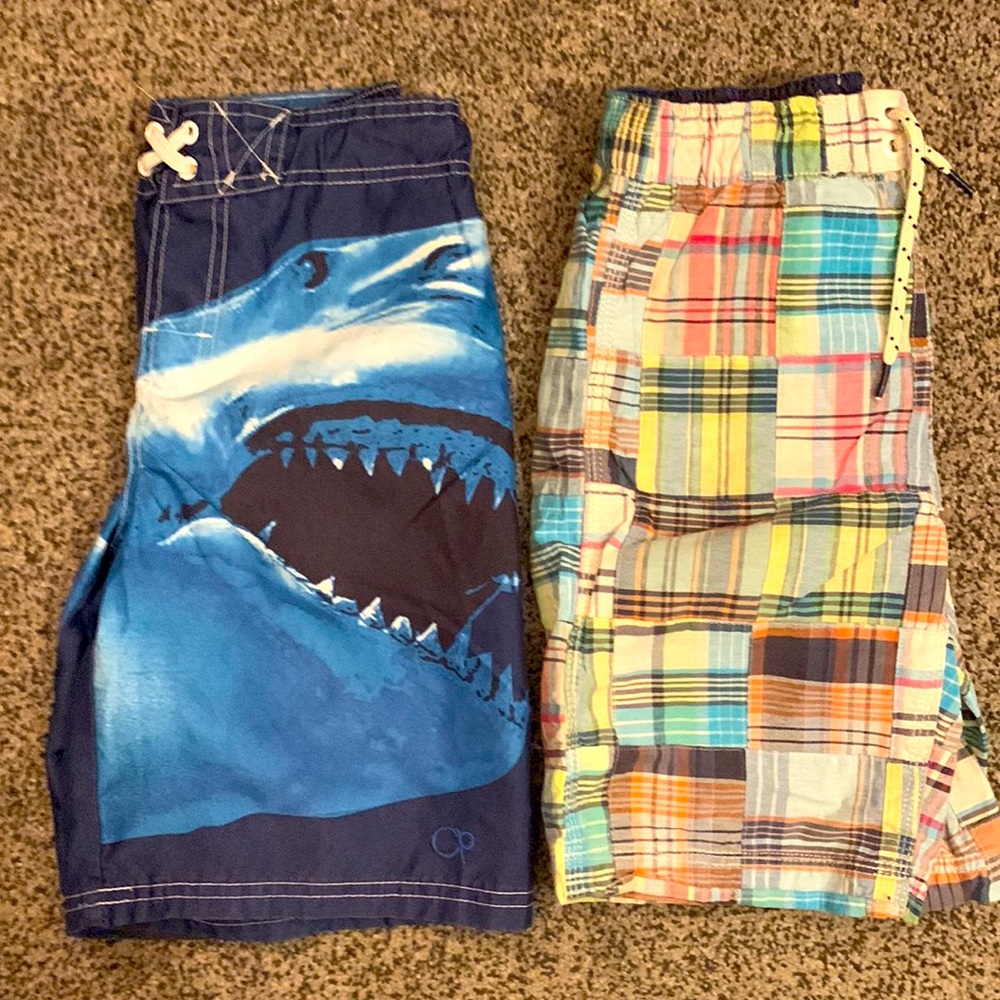 (2) Boys swim trunks. Both size M. Good condition. Various brands.